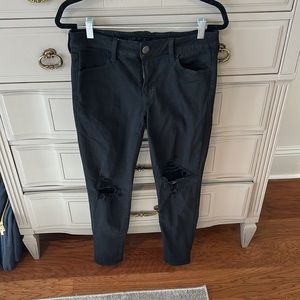 Black skinny jeans with knee rips